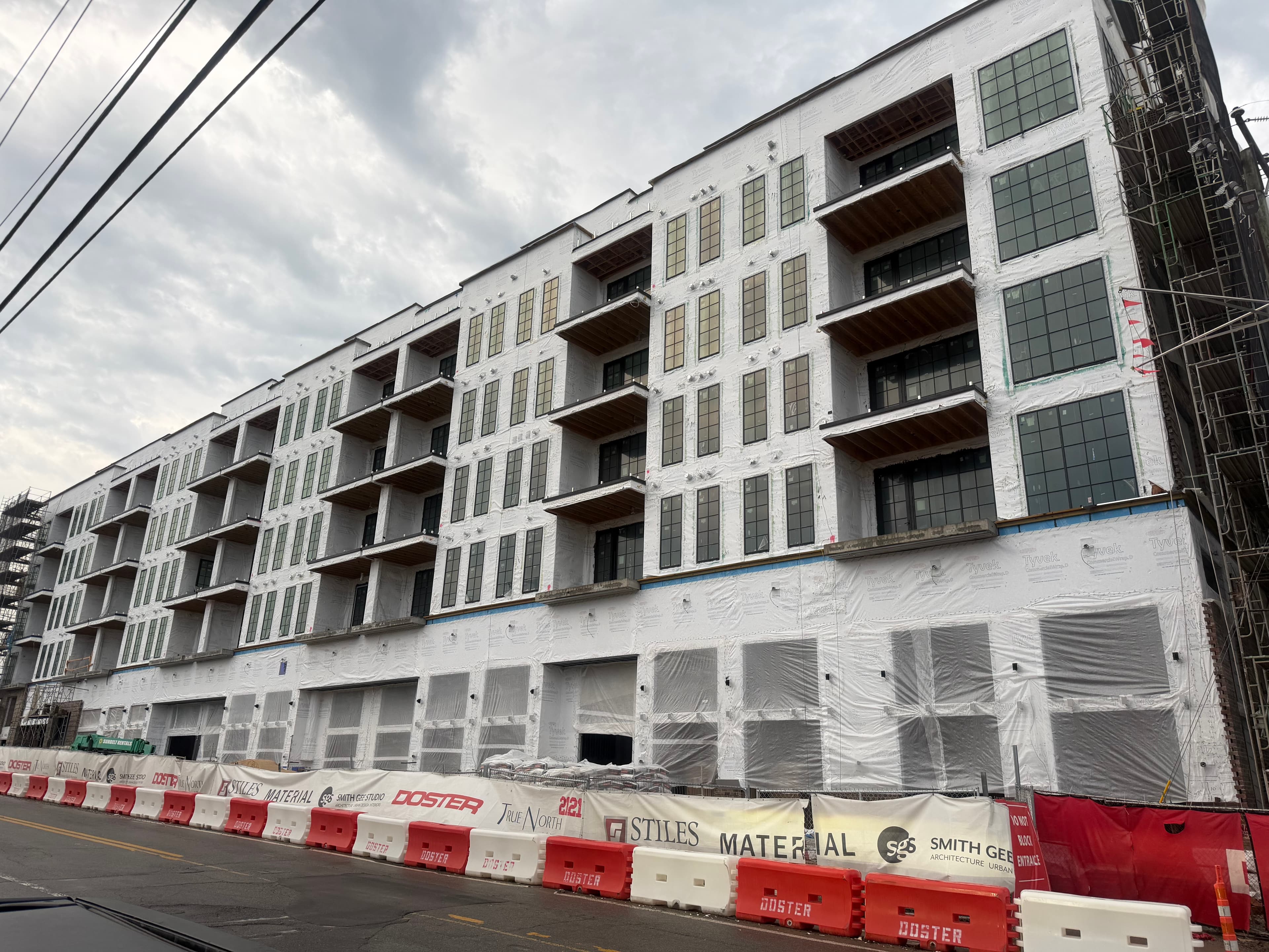 Construction site with fence wrap screening